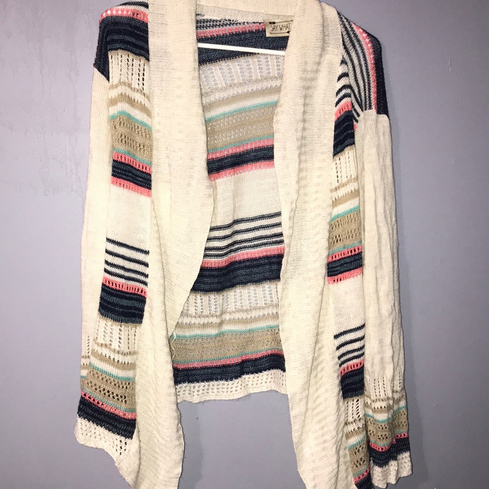 A cardigan tan with pink blue strips